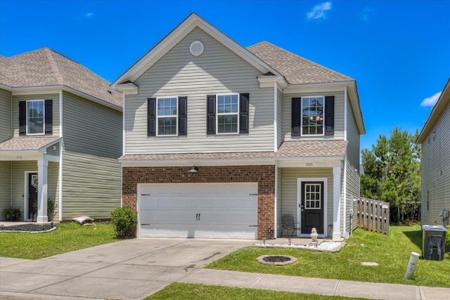 260 Claudia Dr, Grovetown, GA 30813 - view of front of home featuring concrete driveway, roof with shingles, an attached garage, and brick siding