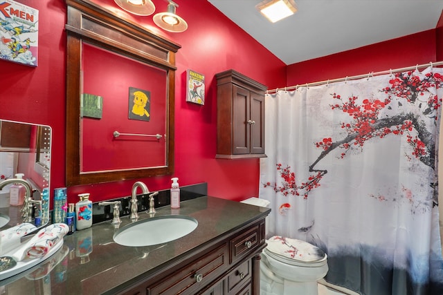 full bath featuring curtained shower, toilet, and vanity