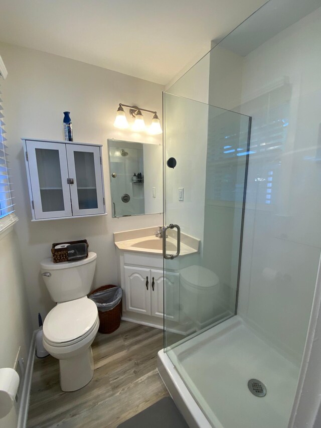 2416 Forest Park Rd, Augusta, GA 30904 - bathroom with wood finished floors, an enclosed shower, and vanity