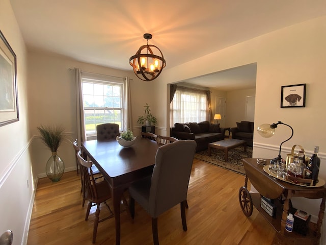 2416 Forest Park Rd, Augusta, GA 30904 - dining space with light wood-style floors, a chandelier, and plenty of natural light