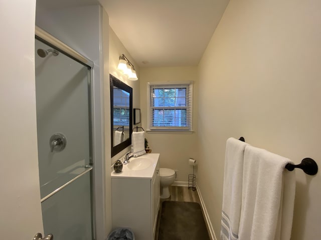 2416 Forest Park Rd, Augusta, GA 30904 - full bathroom featuring an enclosed shower, vanity, and wood finished floors