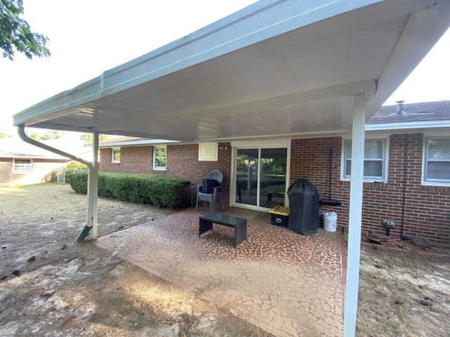 2416 Forest Park Rd, Augusta, GA 30904 - view of patio featuring a grill and a carport