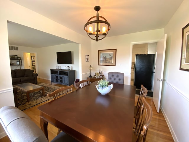 2416 Forest Park Rd, Augusta, GA 30904 - dining room featuring a chandelier and light wood-type flooring