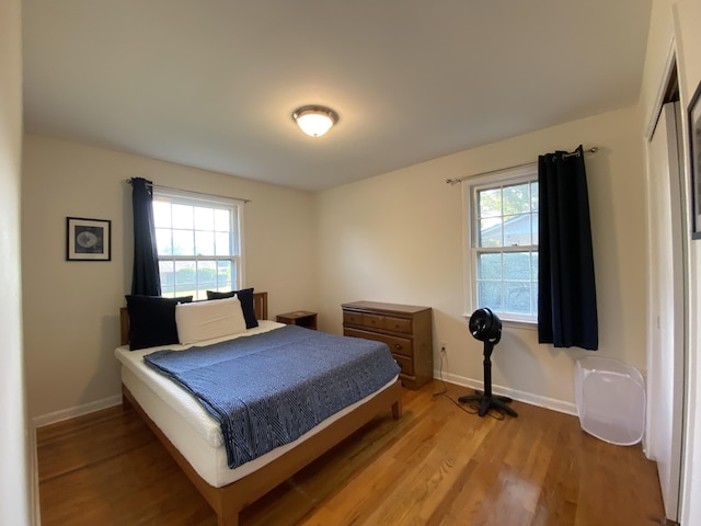 2416 Forest Park Rd, Augusta, GA 30904 - bedroom featuring multiple windows and light wood-type flooring