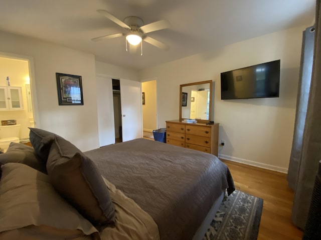 2416 Forest Park Rd, Augusta, GA 30904 - bedroom featuring wood finished floors, connected bathroom, a ceiling fan, and a closet