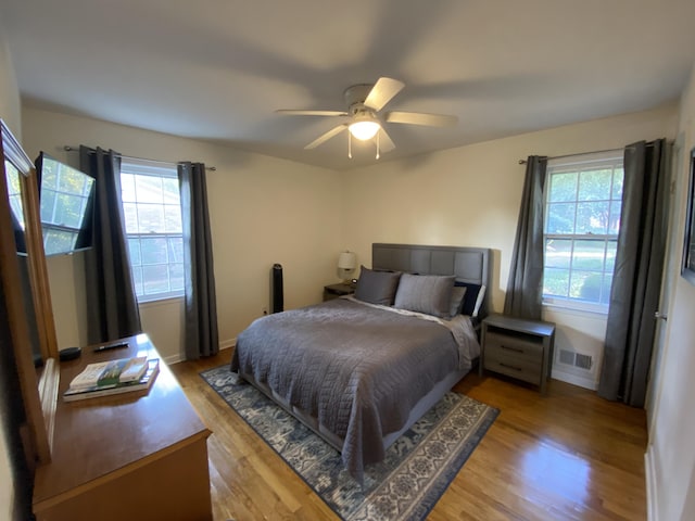 2416 Forest Park Rd, Augusta, GA 30904 - bedroom featuring multiple windows, wood finished floors, and a ceiling fan