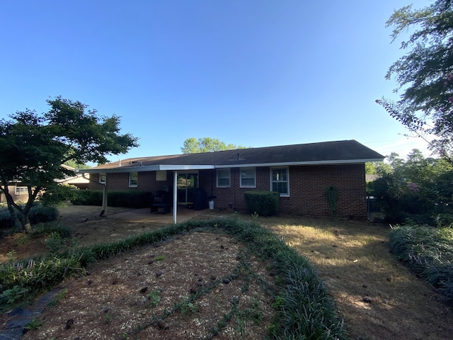 2416 Forest Park Rd, Augusta, GA 30904 - rear view of house featuring brick siding and a patio