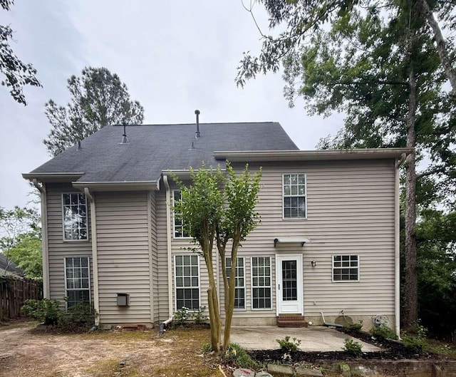 back of house featuring a patio area, fence, and entry steps