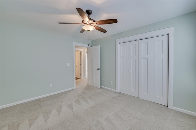 997 Glenhaven Dr, Evans, GA 30809 - unfurnished bedroom with light carpet, a ceiling fan, and a closet