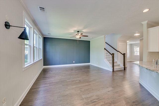 997 Glenhaven Dr, Evans, GA 30809 - unfurnished living room with ornamental molding, a ceiling fan, stairs, wood finished floors, and recessed lighting