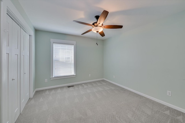 997 Glenhaven Dr, Evans, GA 30809 - unfurnished bedroom with light carpet, a closet, and ceiling fan