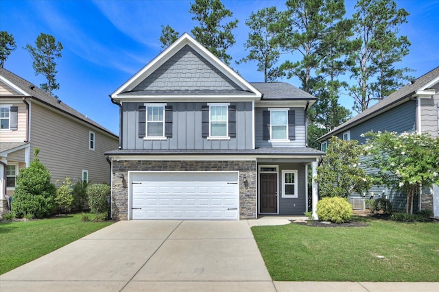 997 Glenhaven Dr, Evans, GA 30809 - craftsman house featuring stone siding, a garage, board and batten siding, driveway, and a front lawn