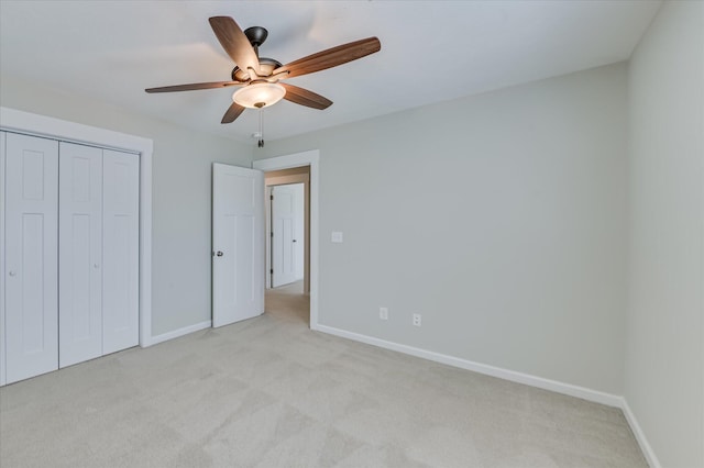997 Glenhaven Dr, Evans, GA 30809 - unfurnished bedroom with light colored carpet, a closet, and a ceiling fan