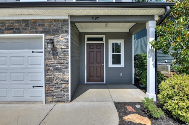 997 Glenhaven Dr, Evans, GA 30809 - doorway to property with stone siding and a garage