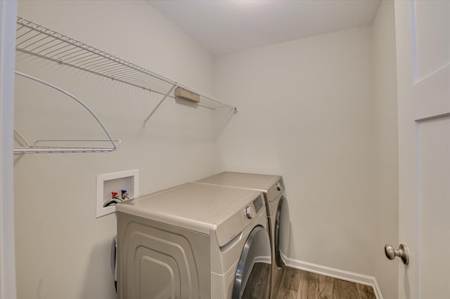997 Glenhaven Dr, Evans, GA 30809 - laundry room featuring independent washer and dryer and dark wood-style flooring