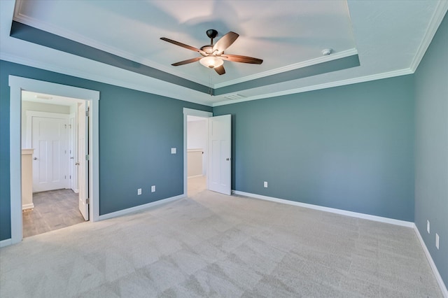 997 Glenhaven Dr, Evans, GA 30809 - unfurnished bedroom with crown molding, a tray ceiling, carpet floors, and ceiling fan