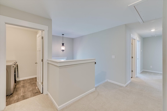 997 Glenhaven Dr, Evans, GA 30809 - corridor featuring attic access, washing machine and dryer, an upstairs landing, and carpet