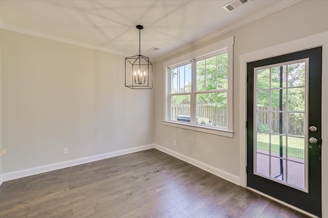 997 Glenhaven Dr, Evans, GA 30809 - unfurnished dining area featuring ornamental molding, a chandelier, and wood finished floors