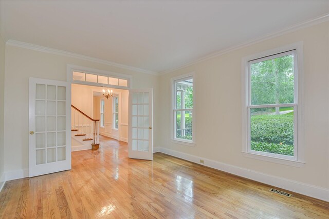 3549 Stevens Way, Martinez, GA 30907 - unfurnished room featuring a chandelier, crown molding, stairs, light wood finished floors, and french doors