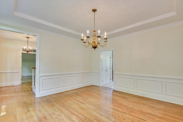 3549 Stevens Way, Martinez, GA 30907 - spare room featuring a chandelier, crown molding, light wood-type flooring, and a wainscoted wall