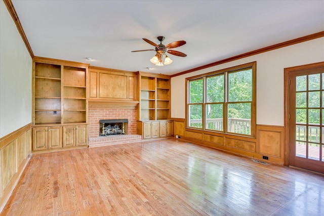 3549 Stevens Way, Martinez, GA 30907 - unfurnished living room featuring ornamental molding, ceiling fan, wainscoting, light wood-style floors, and a fireplace