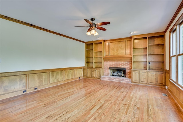 3549 Stevens Way, Martinez, GA 30907 - unfurnished living room with ceiling fan, crown molding, healthy amount of natural light, light wood-type flooring, and a fireplace