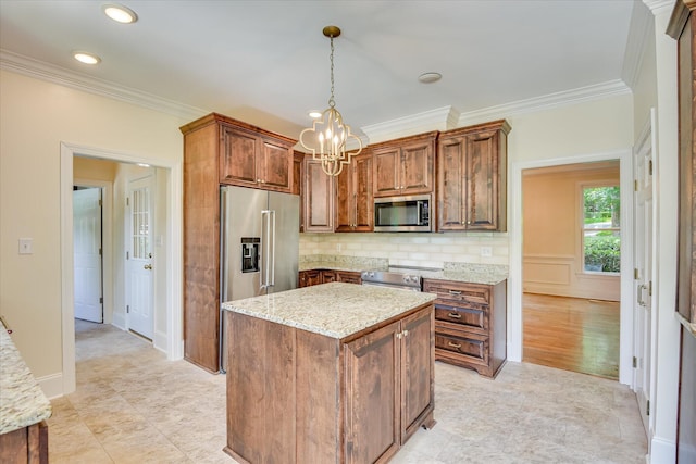 3549 Stevens Way, Martinez, GA 30907 - kitchen with appliances with stainless steel finishes, a chandelier, decorative light fixtures, backsplash, and light stone countertops