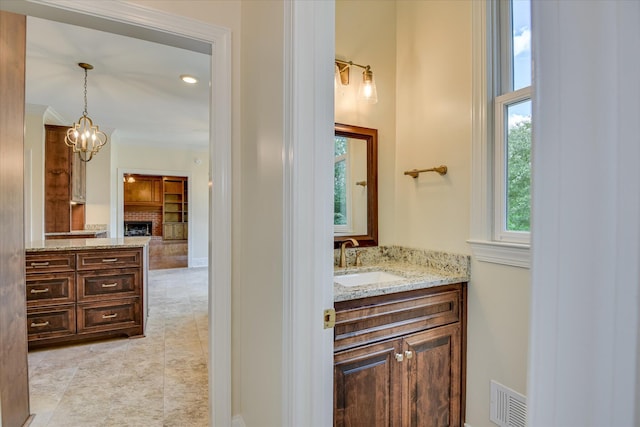 3549 Stevens Way, Martinez, GA 30907 - bathroom with vanity, a chandelier, and a fireplace