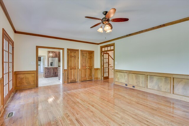 3549 Stevens Way, Martinez, GA 30907 - unfurnished room featuring light wood-type flooring, wainscoting, a ceiling fan, crown molding, and a decorative wall