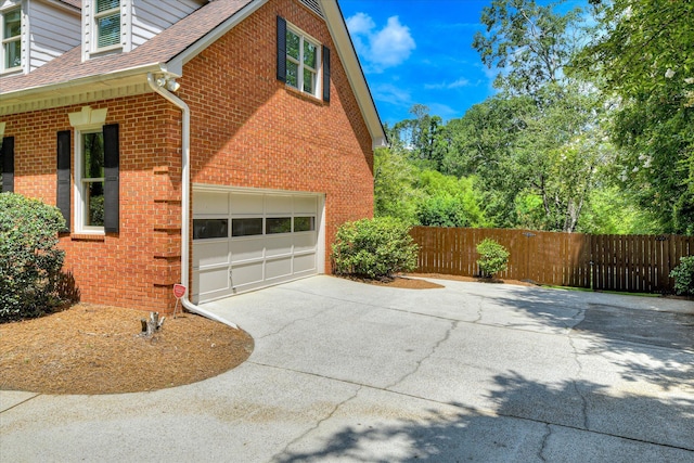 3549 Stevens Way, Martinez, GA 30907 - view of home's exterior featuring driveway, a shingled roof, brick siding, and a garage