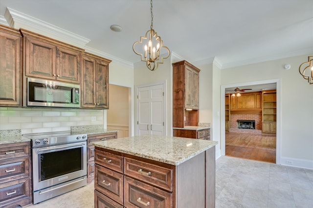 3549 Stevens Way, Martinez, GA 30907 - kitchen featuring stainless steel appliances, ornamental molding, a ceiling fan, a chandelier, and tasteful backsplash