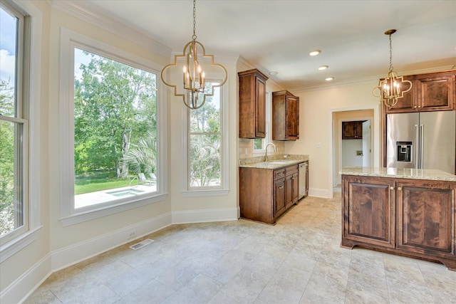 3549 Stevens Way, Martinez, GA 30907 - kitchen featuring a chandelier, stainless steel appliances, light stone counters, healthy amount of natural light, and ornamental molding