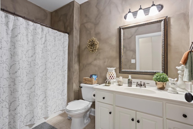 bathroom with tile patterned floors, vanity, and toilet