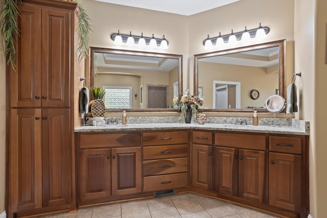 bathroom with tile patterned flooring and vanity