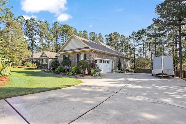 view of front of property with a front lawn and a garage