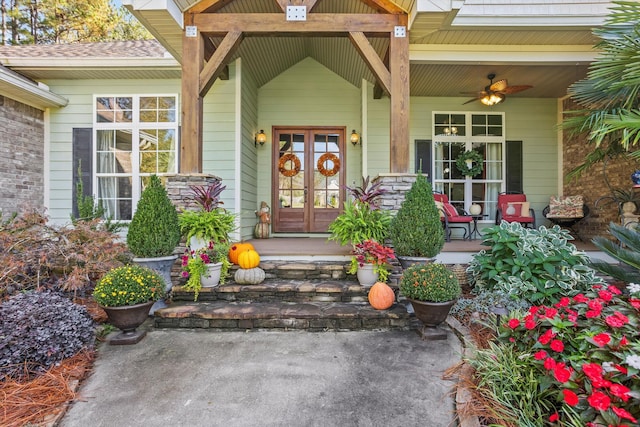 property entrance with ceiling fan and a porch