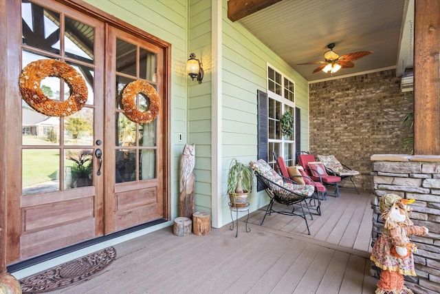 doorway to property with ceiling fan, a porch, and french doors