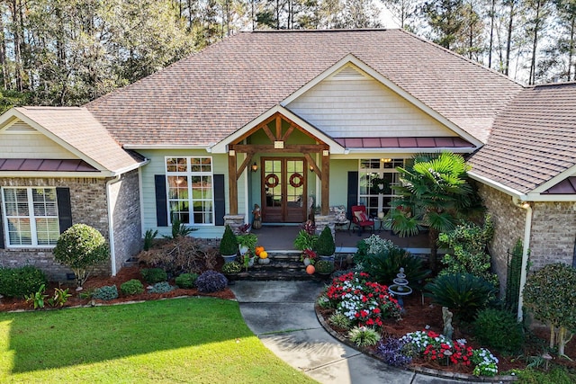 craftsman-style house with a front lawn and a porch