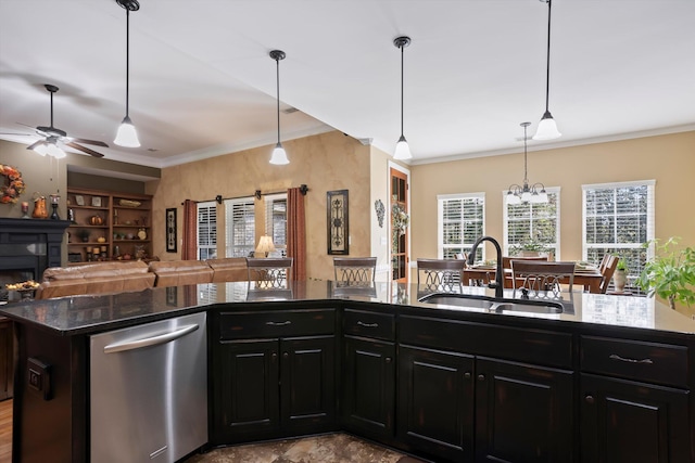 kitchen featuring pendant lighting, dishwasher, ornamental molding, and sink