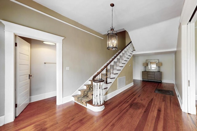 116 Jackson Rd, Jackson, SC 29831 - stairs featuring wood-type flooring, baseboards, and a chandelier