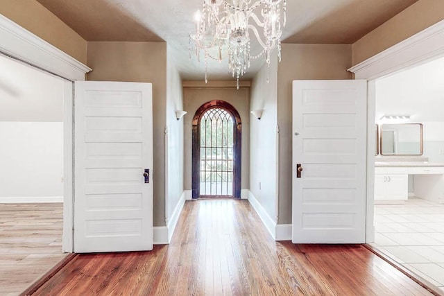 116 Jackson Rd, Jackson, SC 29831 - foyer entrance featuring wood finished floors, a chandelier, and baseboards