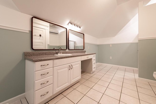 116 Jackson Rd, Jackson, SC 29831 - bathroom featuring a wall mounted air conditioner, tile patterned floors, vanity, vaulted ceiling, and baseboards