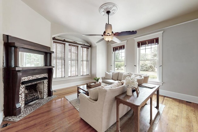 116 Jackson Rd, Jackson, SC 29831 - living area featuring baseboards, a fireplace, a ceiling fan, and light wood-style flooring
