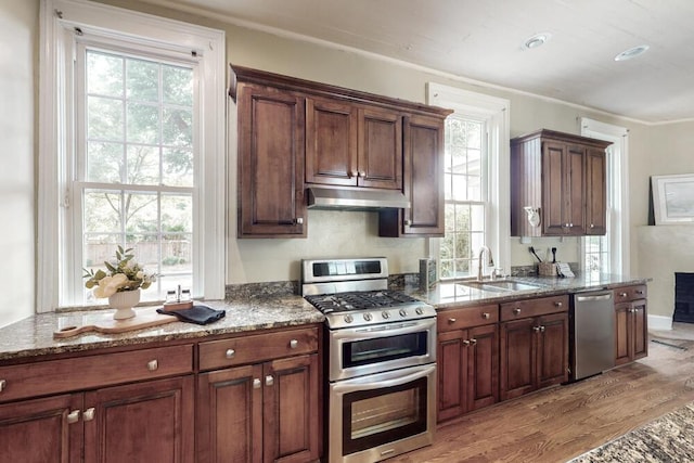 116 Jackson Rd, Jackson, SC 29831 - kitchen with stainless steel appliances, under cabinet range hood, a sink, light wood finished floors, and stone countertops
