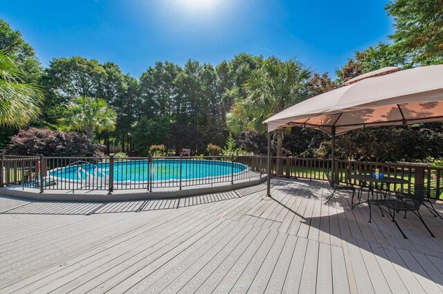 116 Jackson Rd, Jackson, SC 29831 - view of swimming pool featuring a gazebo, a wooden deck, and view of wooded area