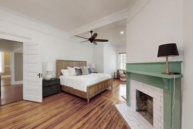 116 Jackson Rd, Jackson, SC 29831 - bedroom with wood finished floors, crown molding, a brick fireplace, beamed ceiling, and a ceiling fan