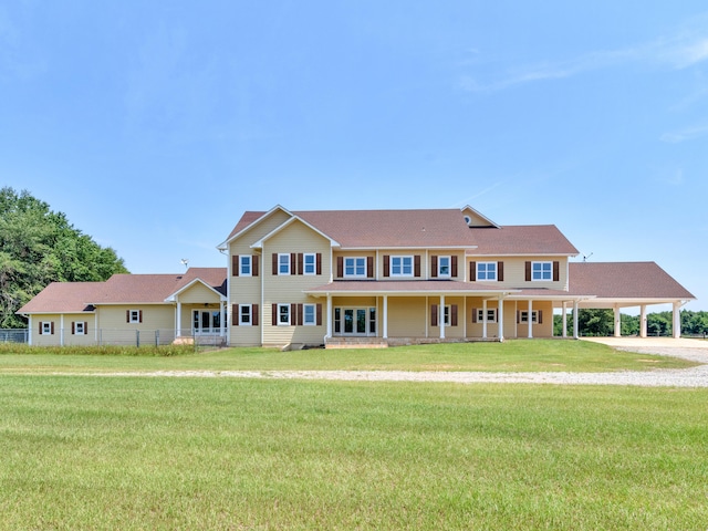 colonial home with a front lawn