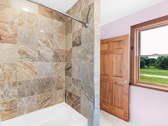 bathroom with tile patterned flooring and tiled shower / bath combo