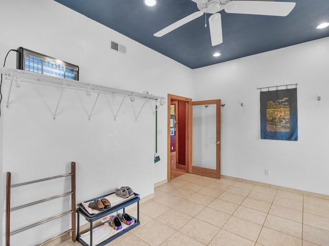 unfurnished room featuring ceiling fan and light tile patterned flooring