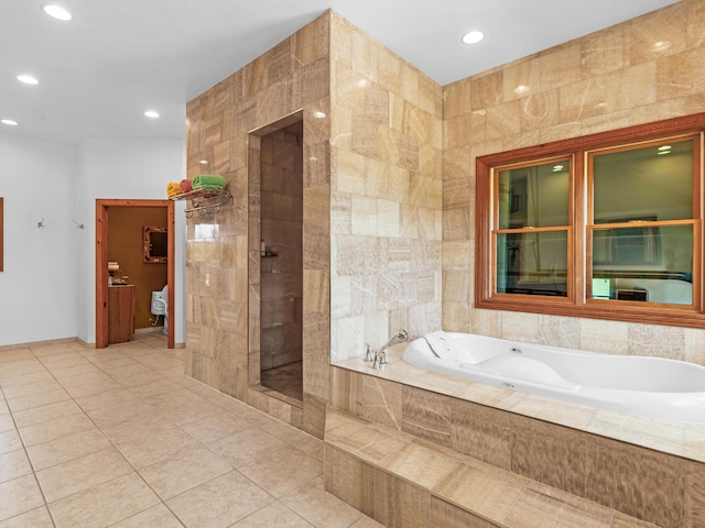 bathroom featuring tile patterned floors and shower with separate bathtub